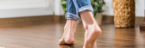 young woman walking in the house on the warm floor