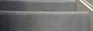 Older, discolored carpet on stairs