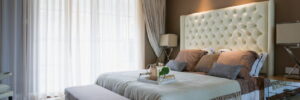 comfortable bedroom with nice carpeting and decor